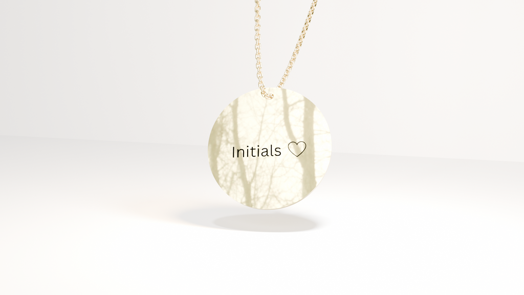 Luna Edition gold necklace with a pendant engraved 'Initials' on a white background