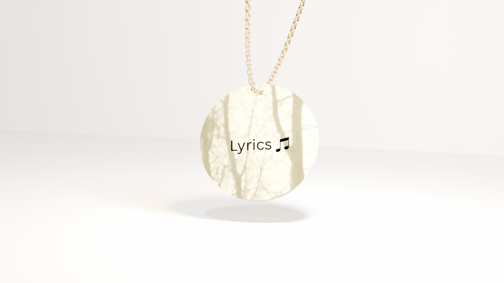 Gold necklace with a pendant labeled 'Lyrics' on a white background
